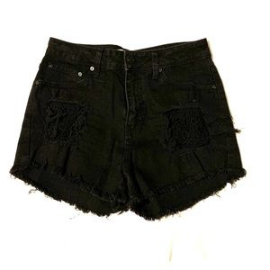 High waisted destroyed black denim shorts